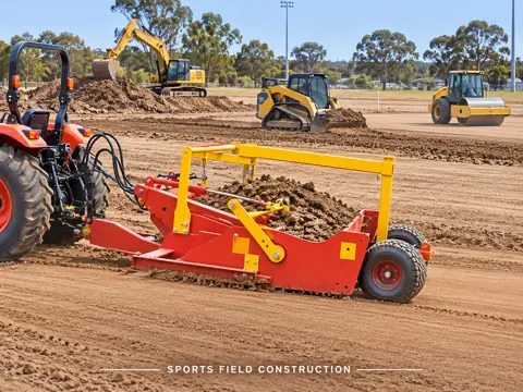 Red Scraper Grading a New Sports Field — application concept